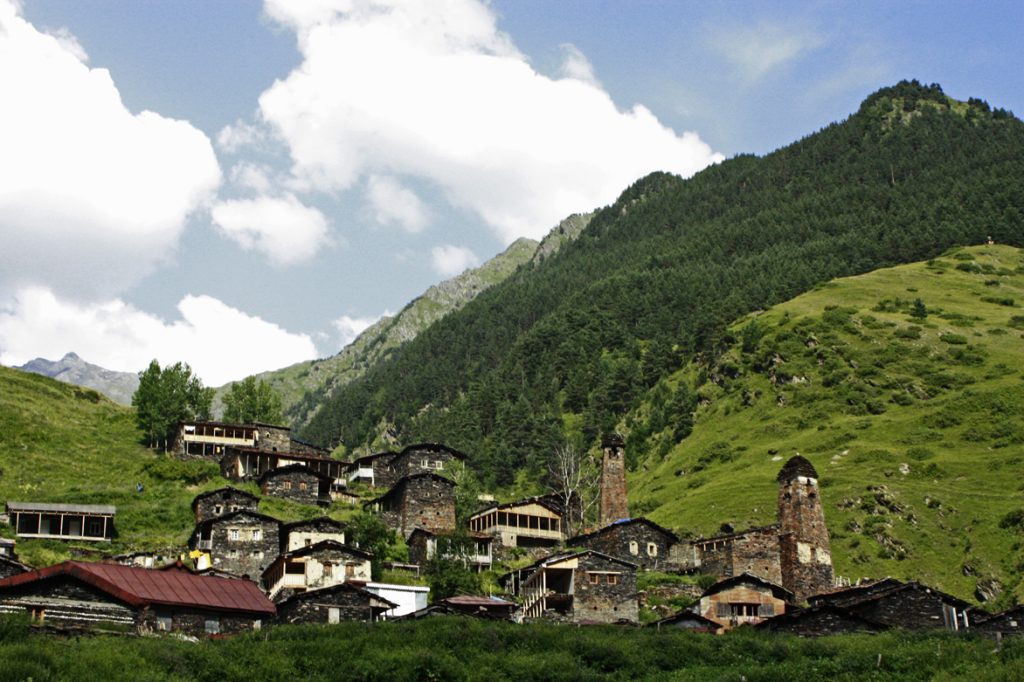 A traditional Tusheti mountain village with stone defensive towers near the festival region.