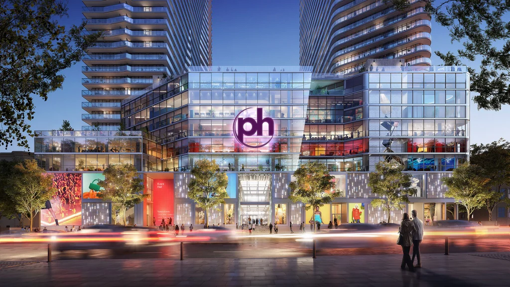 Planet Hollywood Hotel & Casino Tbilisi — Rendering of the illuminated podium entrance with shops and dining beneath the towers at dusk.